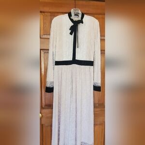 size 6-8  Ivory with black velvet trim beautiful waisted fit